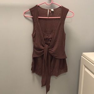 Dressy purple blouse with ruffles and tie front.